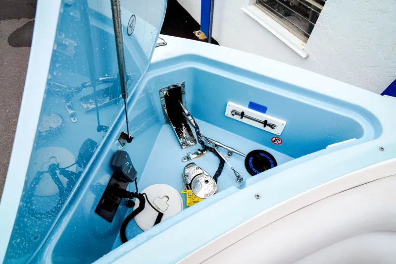 Slide: The Image of 2022 Aviara AV32 OB boat anchor compartment with equipment and storage. - 8