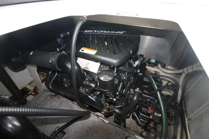 Slide: The Image of Engine compartment of 2006 Four Winns 378 Vista boat, featuring a MerCruiser engine. - 11