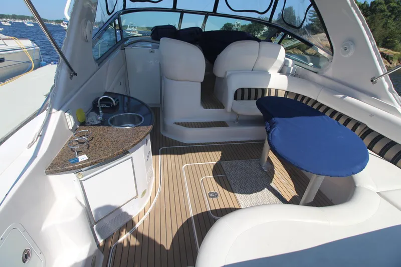 Slide: The Image of 2006 Four Winns 378 Vista yacht interior with seating, table, and kitchenette. - 12