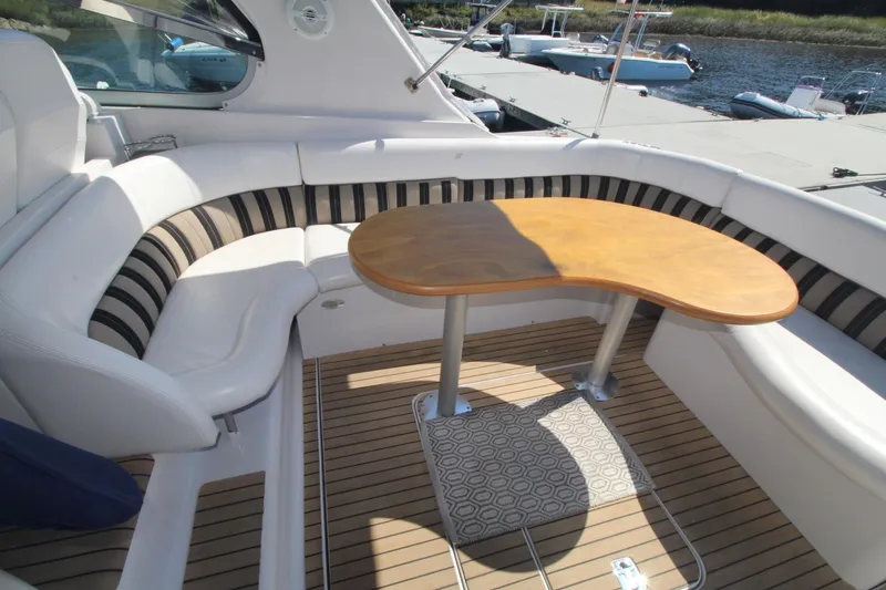 Slide: The Image of Luxurious 2006 Four Winns 378 Vista yacht interior with elegant seating and wooden table. - 14