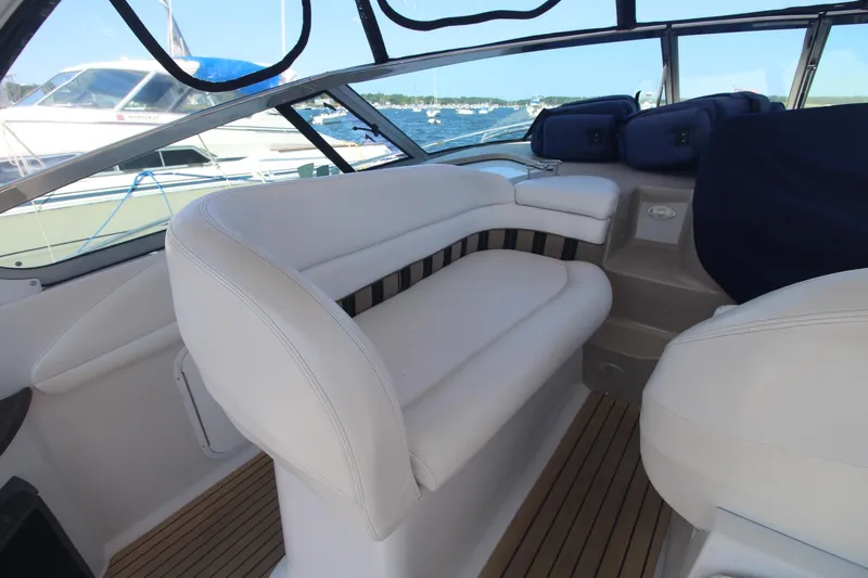 Slide: The Image of 2006 Four Winns 378 Vista boat interior with white seating and wood flooring. - 17