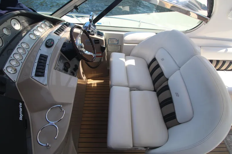 Slide: The Image of 2006 Four Winns 378 Vista boat interior with plush seating and modern dashboard. - 19