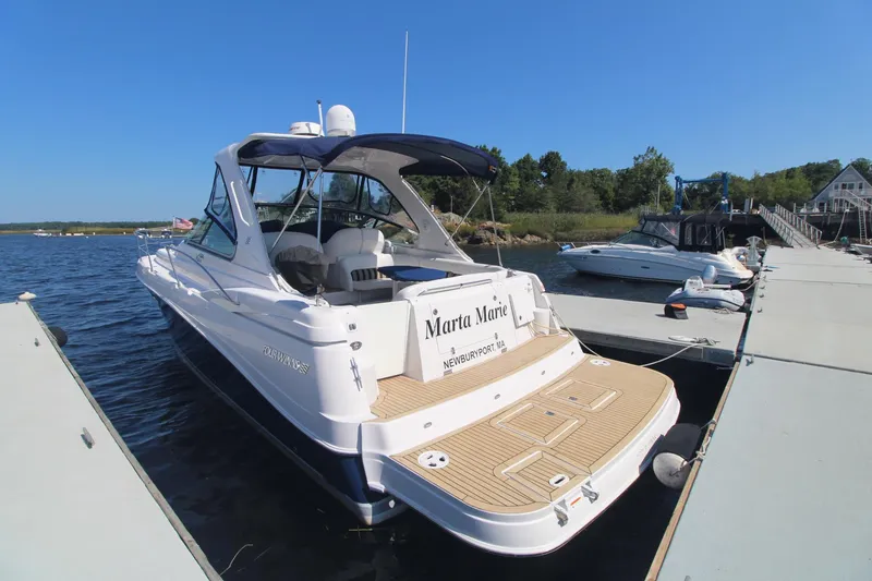 Slide: The Image of 2006 Four Winns 378 Vista yacht docked at marina under clear blue sky. - 2