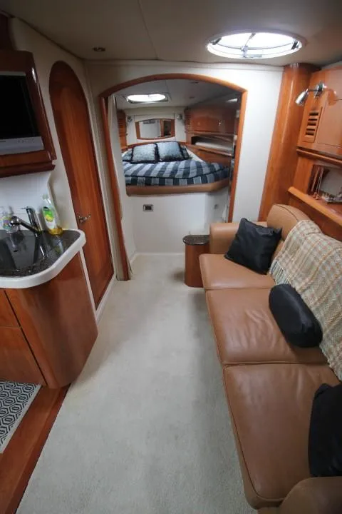 Slide: The Image of Interior of 2006 Four Winns 378 Vista yacht with cozy seating and sleeping area. - 28