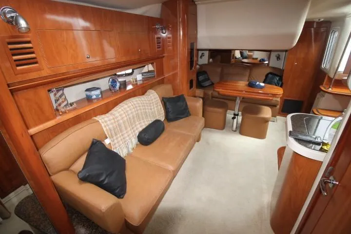 Slide: The Image of Luxurious 2006 Four Winns 378 Vista yacht interior with plush seating and elegant wood finishes. - 29