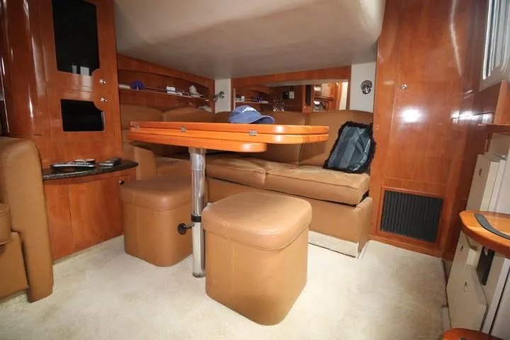 Slide: The Image of Interior of 2006 Four Winns 378 Vista yacht with leather seating and wooden finishes. - 33