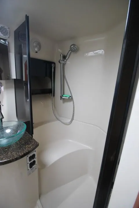 Slide: The Image of 2006 Four Winns 378 Vista bathroom with modern shower and glass sink. - 37