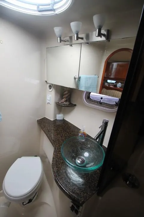Slide: The Image of 2006 Four Winns 378 Vista yacht bathroom with glass sink and modern fixtures. - 40