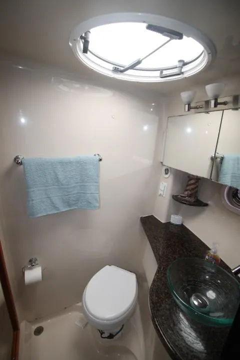 Slide: The Image of 2006 Four Winns 378 Vista yacht bathroom with modern fixtures and porthole window. - 41