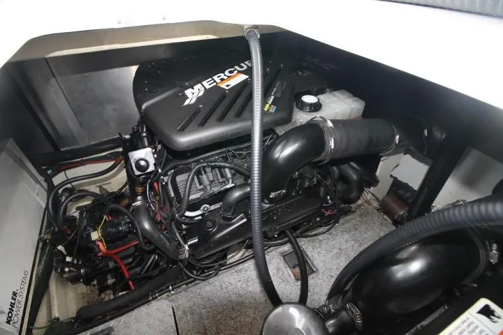 Slide: The Image of Engine compartment of a 2006 Four Winns 378 Vista boat with a Mercury engine. - 47