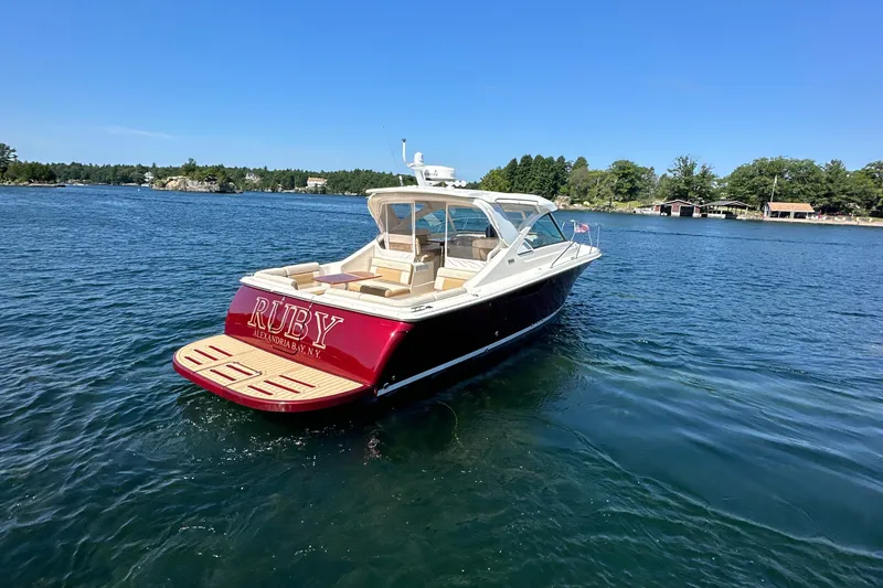 Slide: The Image of 2014 Tiara Yachts 3100 Coronet on water, rear view, sunny day. - 2