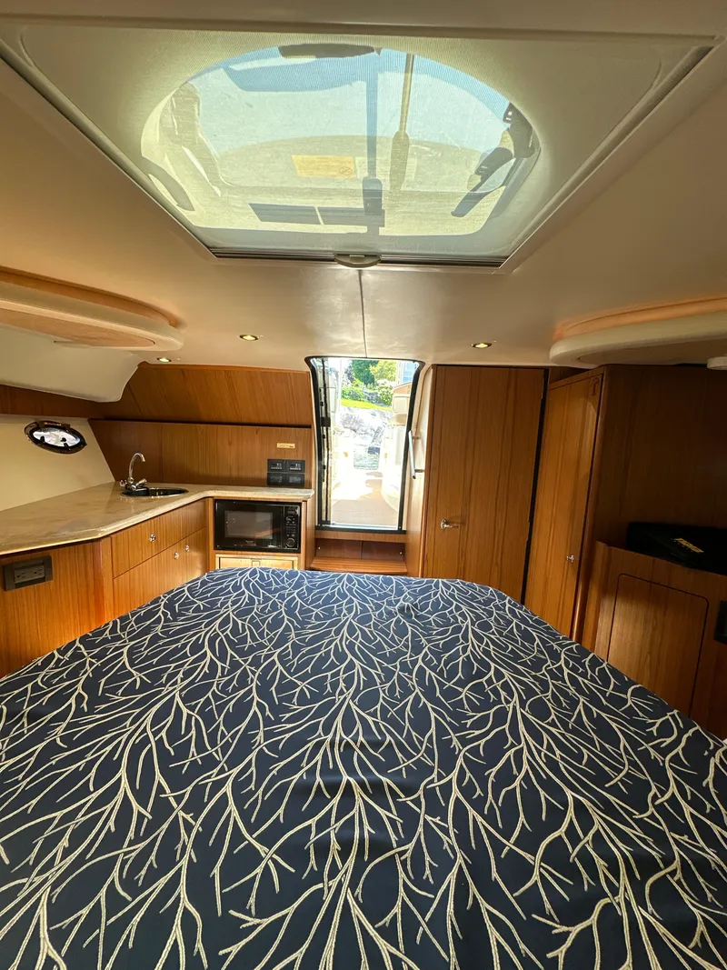 Slide: The Image of Interior of 2014 Tiara Yachts 3100 Coronet with skylight and modern amenities. - 21