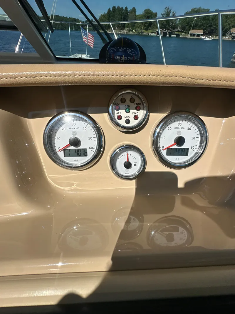 Slide: The Image of Dashboard of 2014 Tiara Yachts 3100 Coronet with gauges, on a sunny day. - 22
