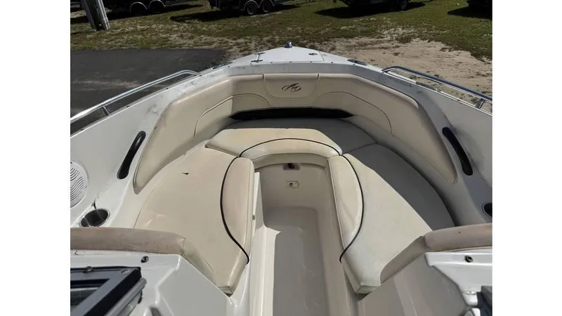 Slide: The Image of 2007 Monterey 234FS boat interior with white cushioned seating. - 3