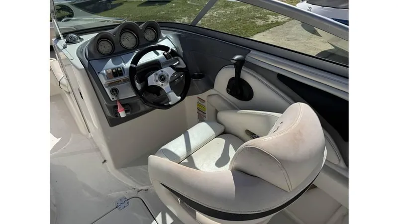 Slide: The Image of 2007 Monterey 234FS boat cockpit with steering wheel and gauges. - 4