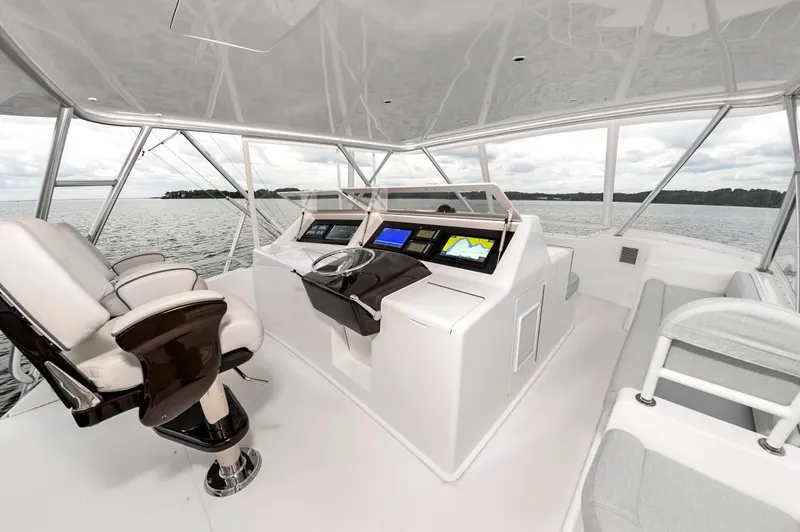 Slide: The Image of Interior helm of 2003 Viking 61 Convertible yacht with modern navigation equipment. - 12