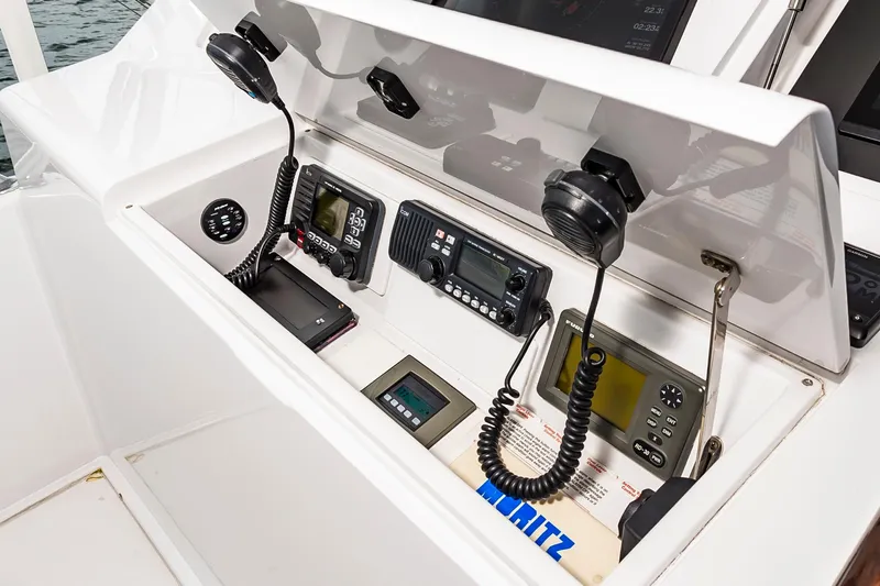 Slide: The Image of 2003 Viking 61 Convertible yacht control panel with communication devices and navigation equipment. - 17