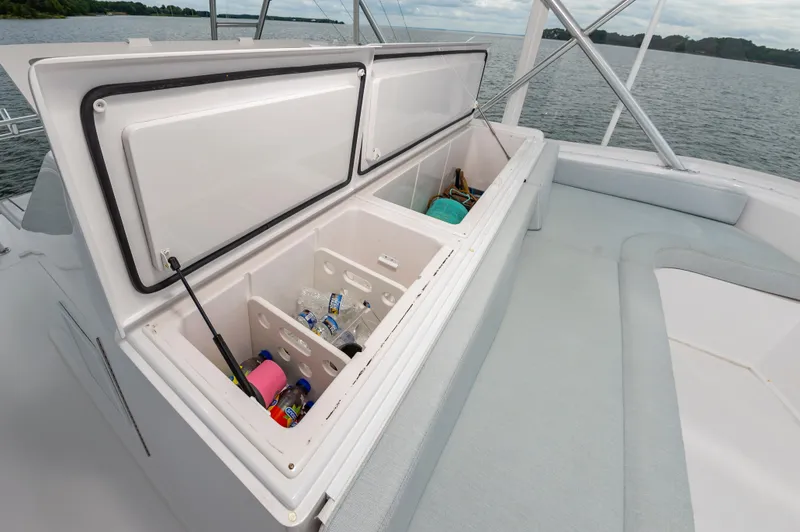 Slide: The Image of Open storage compartment on 2003 Viking 61 Convertible yacht with drinks and equipment. - 22