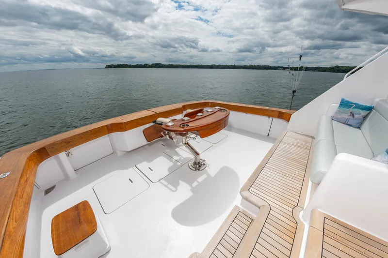 Slide: The Image of Viking 61 Convertible 2003 yacht deck with seating, fishing chair, and ocean view. - 25