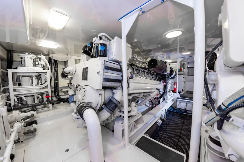 Slide: The Image of Engine room of 2003 Viking 61 Convertible yacht, showcasing machinery and equipment. - 27