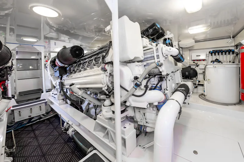 Slide: The Image of Engine room of 2003 Viking 61 Convertible yacht, showcasing powerful machinery and clean design. - 28