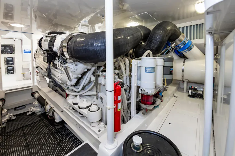 Slide: The Image of Engine room of 2003 Viking 61 Convertible yacht, showcasing machinery and components. - 29