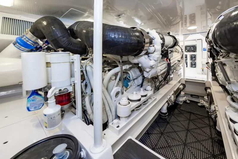 Slide: The Image of Engine room of 2003 Viking 61 Convertible yacht, showcasing machinery and components. - 30