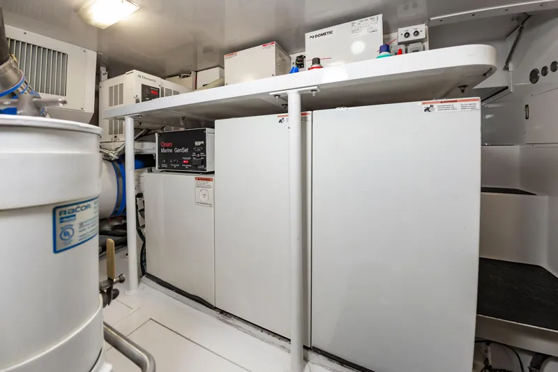 Slide: The Image of Engine room of 2003 Viking 61 Convertible yacht with Onan Marine GenSet. - 31