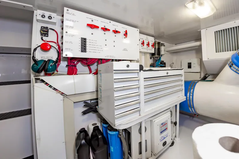 Slide: The Image of Engine room of 2003 Viking 61 Convertible yacht with control panel and equipment. - 32