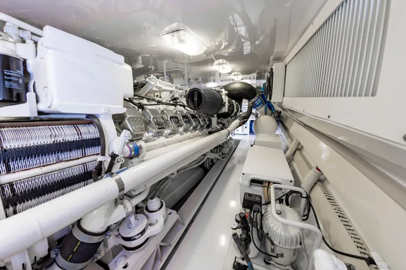 Slide: The Image of Engine room of 2003 Viking 61 Convertible yacht, showcasing detailed machinery and components. - 36
