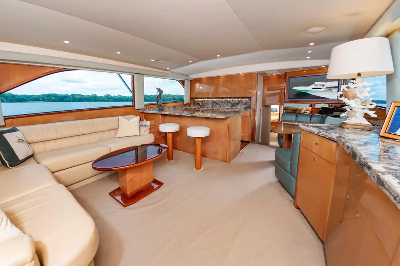 Slide: The Image of Luxurious interior of 2003 Viking 61 Convertible yacht with elegant furnishings and scenic views. - 40