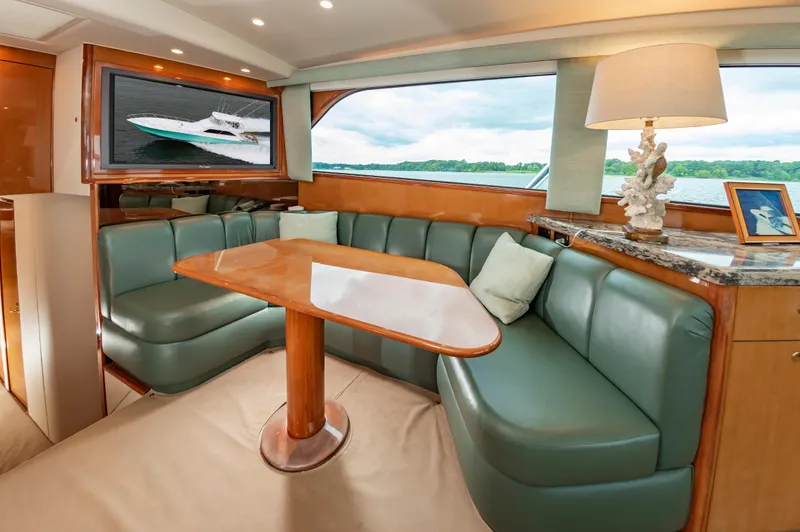 Slide: The Image of Luxurious interior of 2003 Viking 61 Convertible yacht with elegant seating and decor. - 41
