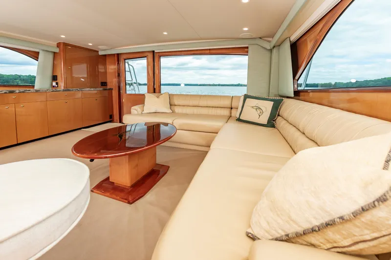 Slide: The Image of Luxurious interior of 2003 Viking 61 Convertible yacht with plush seating and elegant decor. - 43