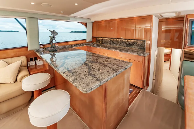Slide: The Image of Luxurious 2003 Viking 61 Convertible yacht interior with elegant granite countertops. - 45