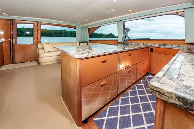 Slide: The Image of Luxurious interior of 2003 Viking 61 Convertible yacht with granite countertops and scenic views. - 46