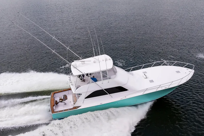 Slide: The Image of 2003 Viking 61 Convertible yacht cruising on open water. - 7