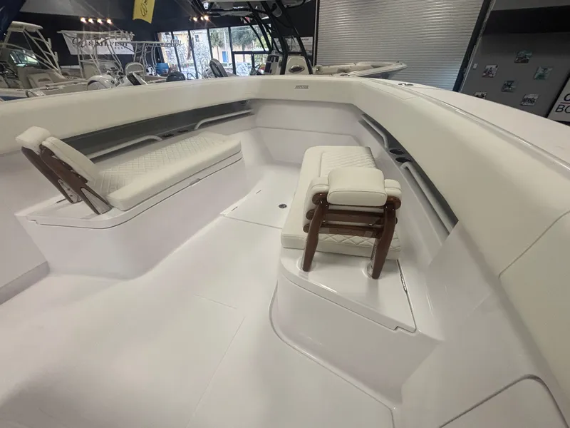Slide: The Image of 2025 Jupiter 380LS boat interior with white seating and sleek design. - 15