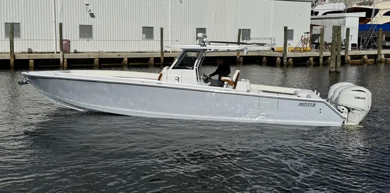 Slide: The Image of 2025 Jupiter 380LS boat with Yamaha engines docked in marina. - 6