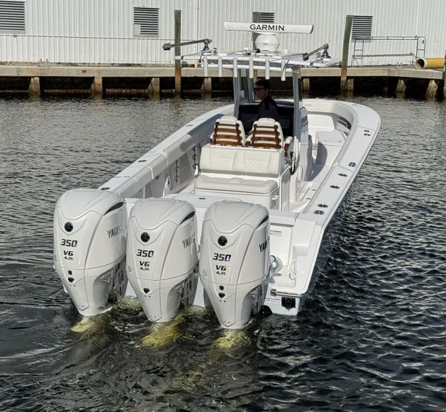 Slide: The Image of 2025 Jupiter 380LS boat with triple Yamaha 350 engines on water. - 7