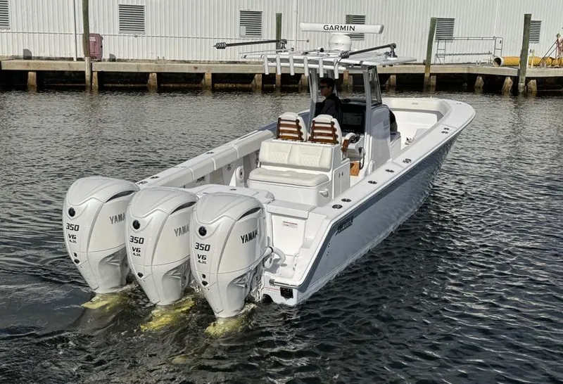Slide: The Image of 2025 Jupiter 380LS boat with triple Yamaha 350 engines on the water. - 8