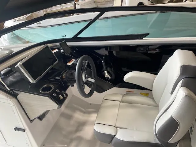 Slide: The Image of 2025 Yamaha Boats AR250 cockpit with modern steering and dashboard design. - 3