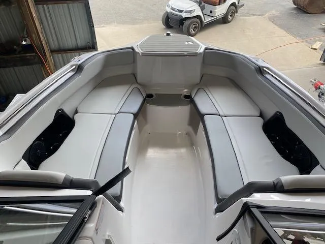 Slide: The Image of 2025 Yamaha Boats AR250 interior with spacious seating and modern design. - 4
