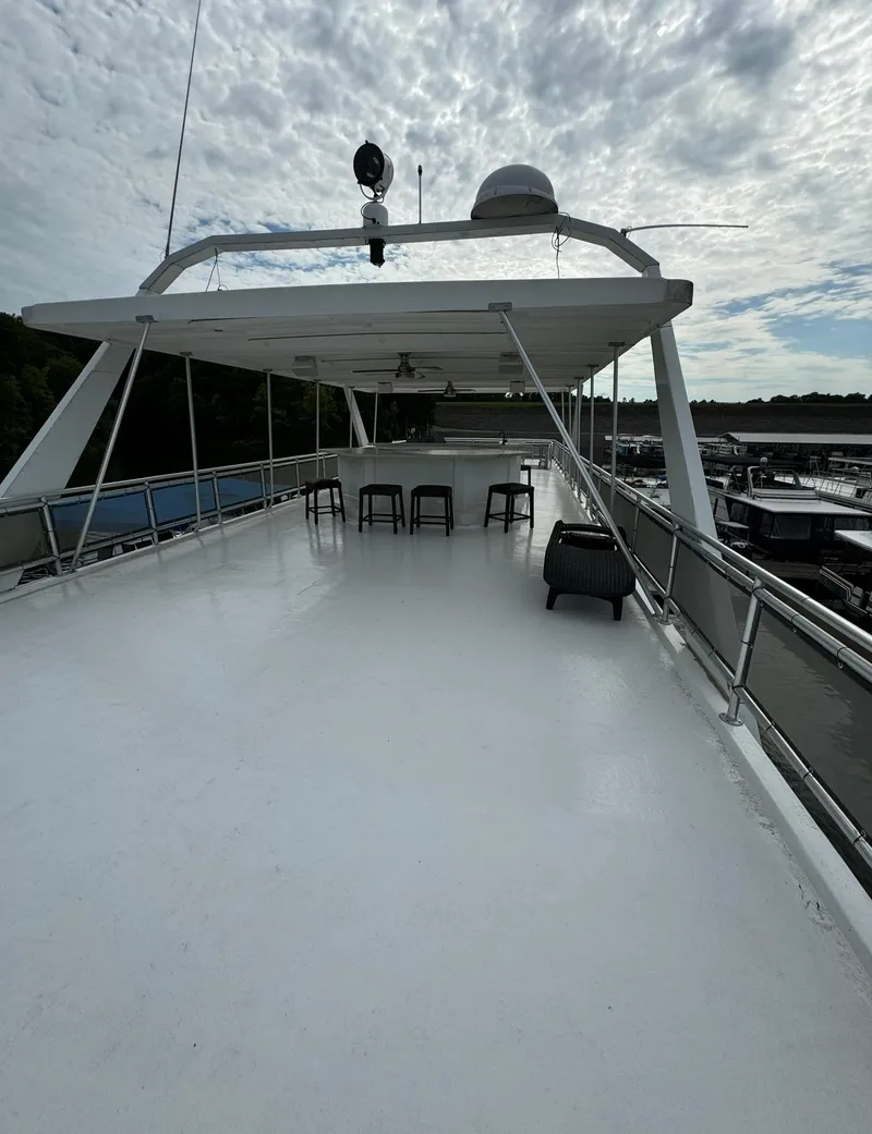Slide: The Image of Spacious upper deck of 2002 Thoroughbred 99 x 20 yacht under cloudy sky. - 11