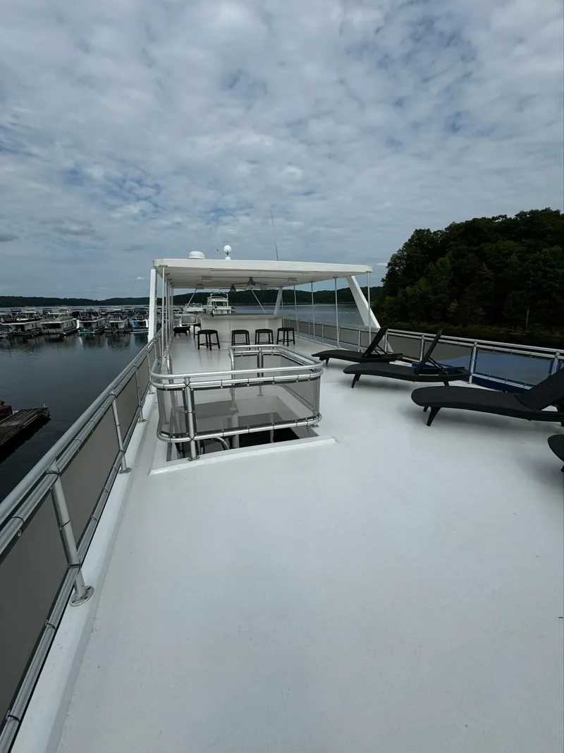 Slide: The Image of Spacious deck of 2002 Thoroughbred 99 x 20 yacht with lounge chairs and scenic view. - 13