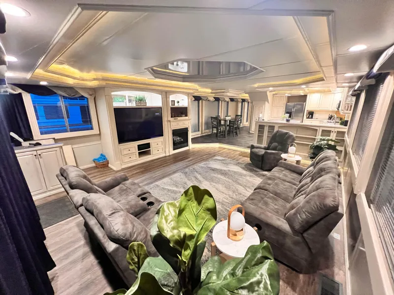 Slide: The Image of Luxurious 2002 Thoroughbred 99 x 20 RV interior with plush seating and modern amenities. - 15