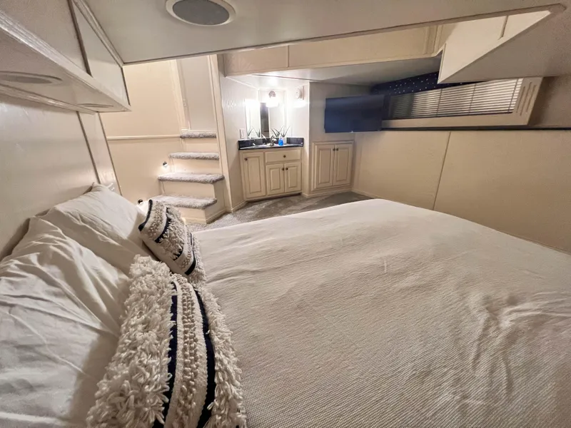 Slide: The Image of Cozy bedroom in 2002 Thoroughbred 99 x 20 houseboat with modern decor and soft lighting. - 20