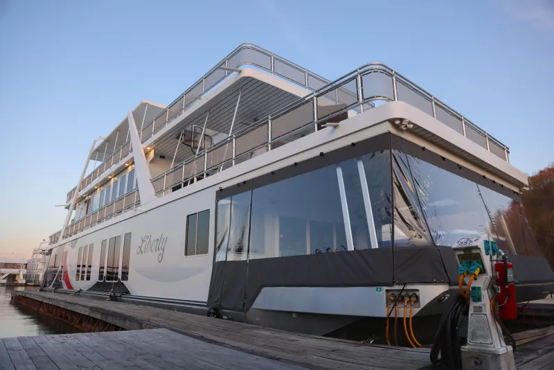 Slide: The Image of Luxurious 2002 Thoroughbred yacht docked, showcasing sleek design and modern amenities. - 3