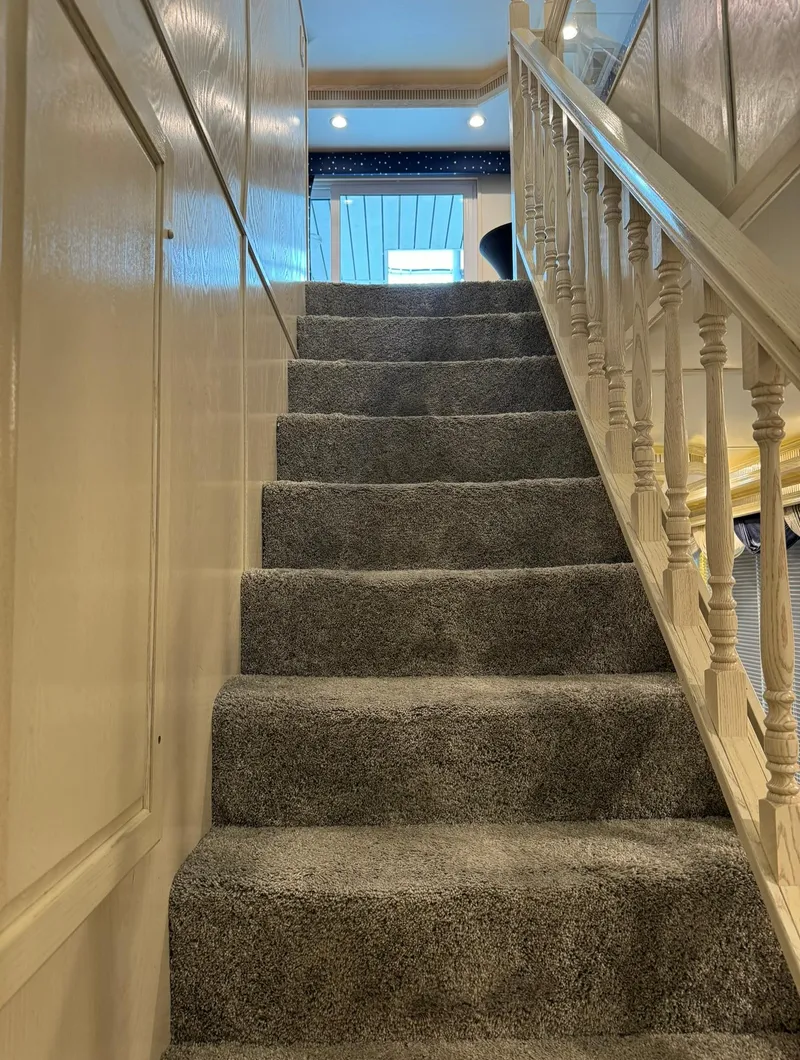 Slide: The Image of Carpeted staircase in a Thoroughbred 99 x 20, 2002 model boat interior. - 38