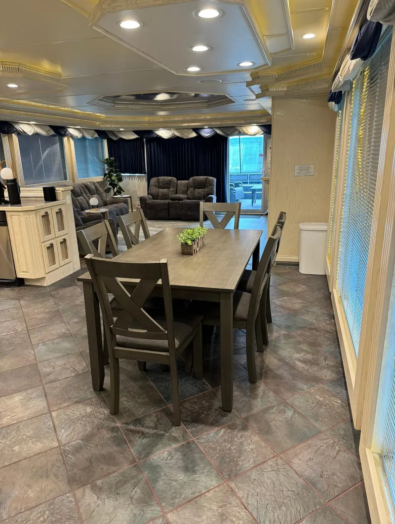 Slide: The Image of Luxurious Thoroughbred 99 x 20 interior, 2002 model, featuring elegant dining area and cozy seating. - 41