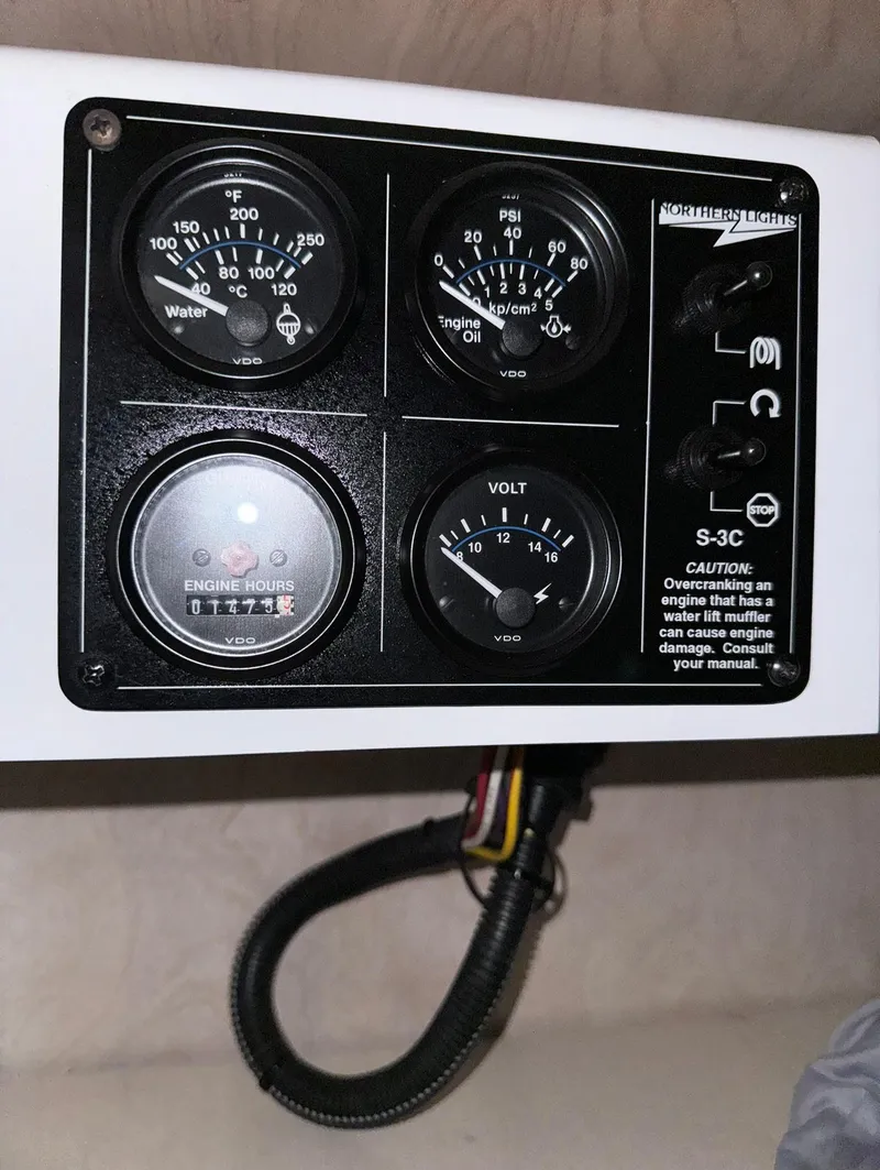 Slide: The Image of Control panel of a 2002 Thoroughbred 99 x 20 with gauges and wiring. - 47